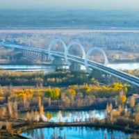 Bridge with O-shape towers links Chinese hubs logo 